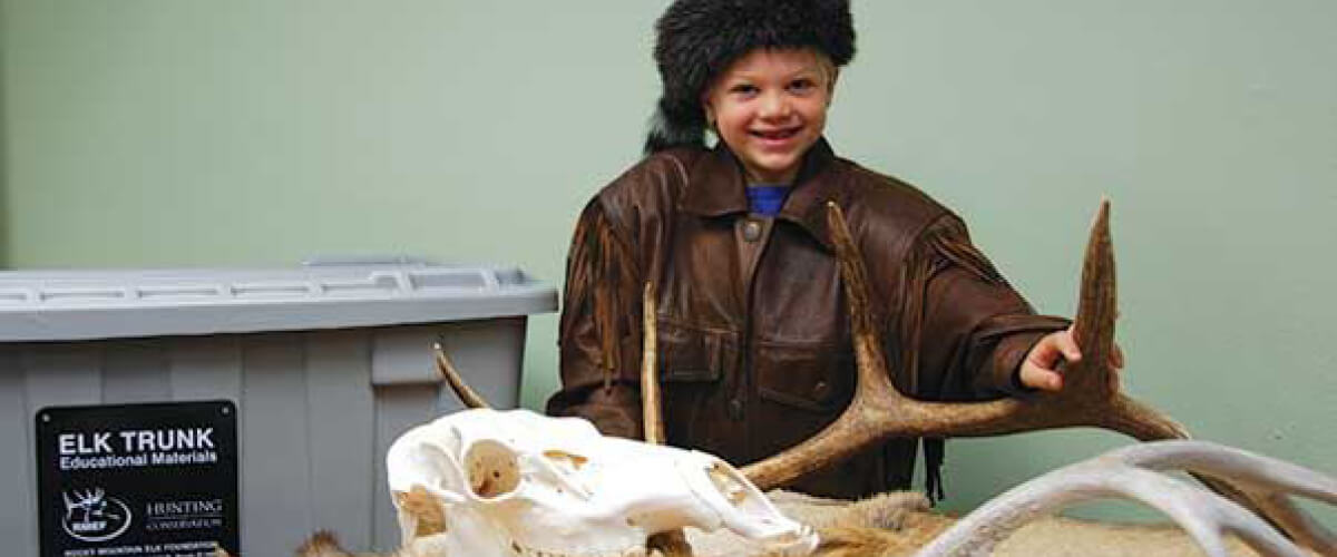 Kid with an elk trunk